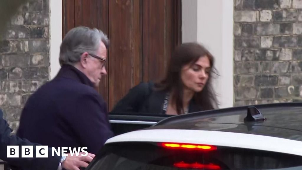 Peter Mandelson led away by police from Camden home