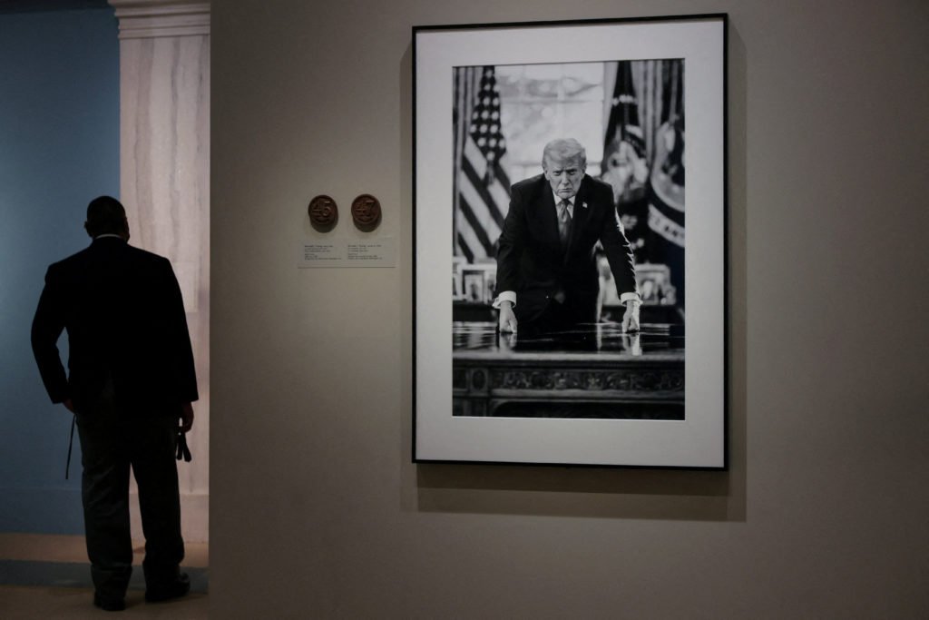 People view the portrait of U.S. President Donald Trump at the Smithsonian National Portrait Gallery in Washington