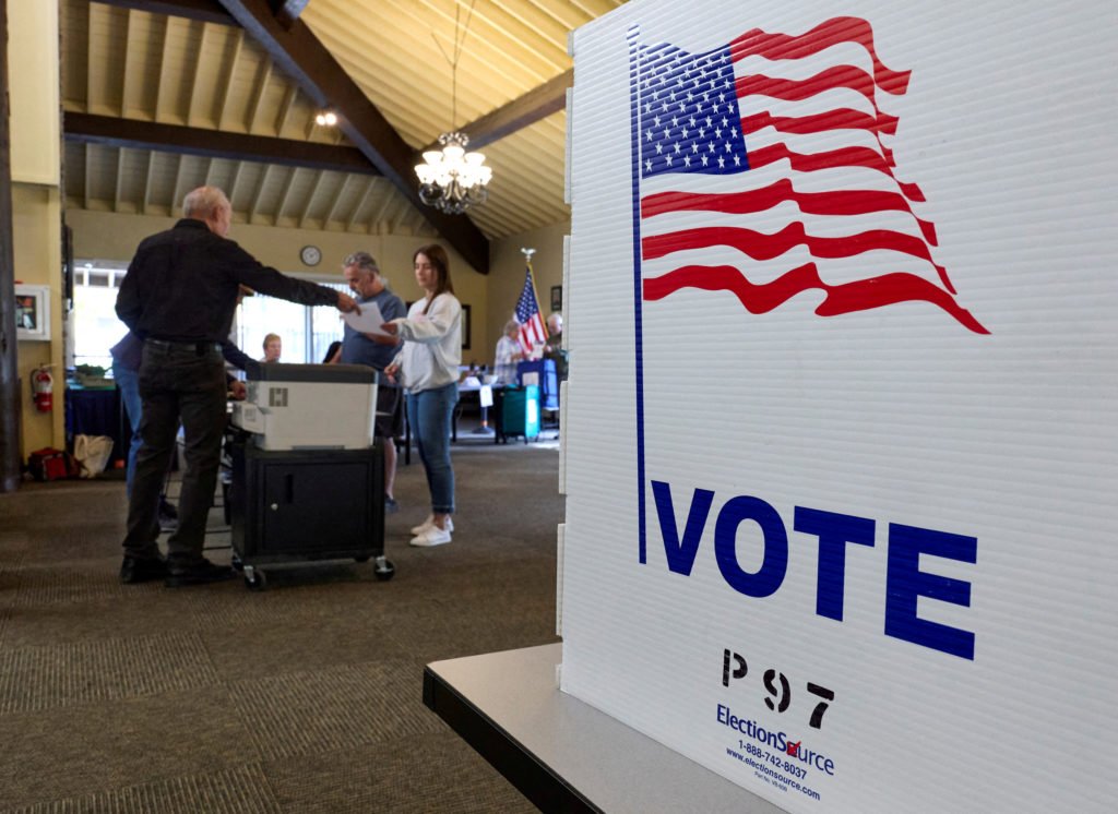 FILE PHOTO: Voters cast ballots on California's Proposition 50