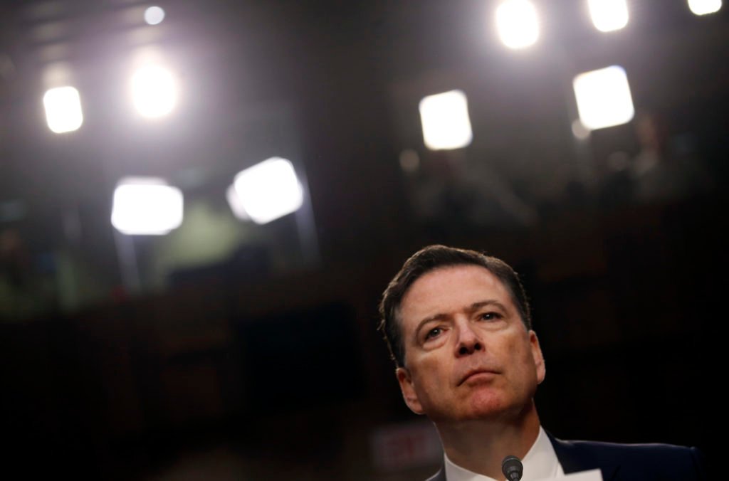 Former FBI Director James Comey pauses as he testifies before a Senate Intelligence Committee hearing on Russia's alleged ...