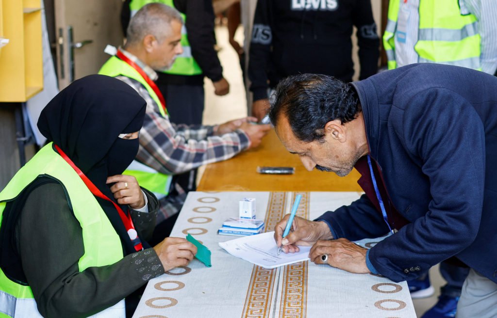 Palestinians vote during the municipal election at a polling station in Deir al-Balah