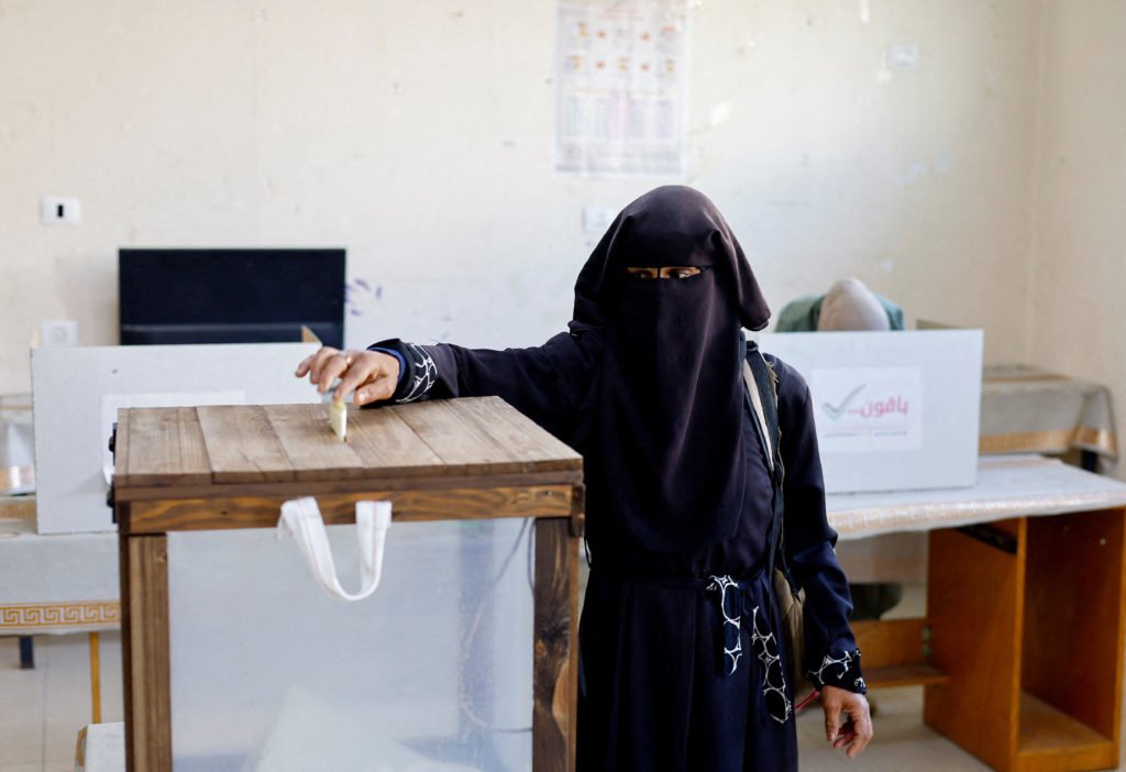 Palestinians vote during the municipal election at a polling station in Deir al-Balah
