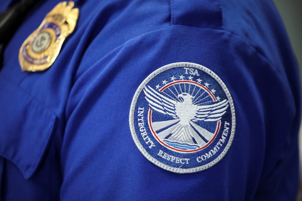 Transportation Security Administration (TSA) works during the first day of a partial U.S. government shutdown in Burbank